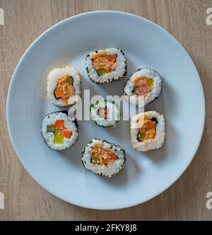 Sushi set of maki on a white plate Stock Photo