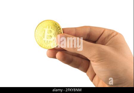 Male hand with bitcoin isolated on the white background, cryptocurrency physical symbol close up Stock Photo