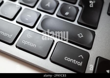 Close up and macro detail view at Enter black keypad buttons of German modern aluminium computer's keyboard. Stock Photo
