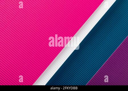Colored corrugated paper texture. Geometric shapes and lines. Minimalist background. Flat lay. Copy space. Stock Photo