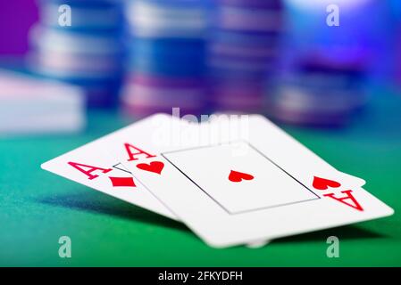 Two aces and stack of Casino Chips in background Stock Photo