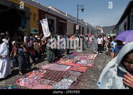 Intricate and vibrant sawdust alfombras decorate the cobblestone streets of Antigua, Guatemala in preparation for the Semana Santa processions. Stock Photo