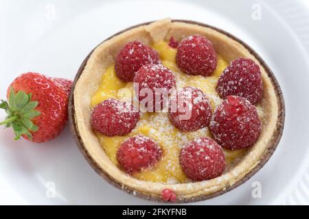 Lemon and raspberry tart with strawberry, food, snack, desert Stock Photo