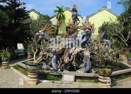 Dragon mosaic sculpture in gardens of the Cantonese Assembly Hall, Hoi An, Vietnam, Asia Stock Photo