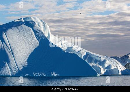 Massive icebergs calved from the Jakobshavn Isbræ glacier, UNESCO World Heritage site, Ilulissat, Greenland. Stock Photo