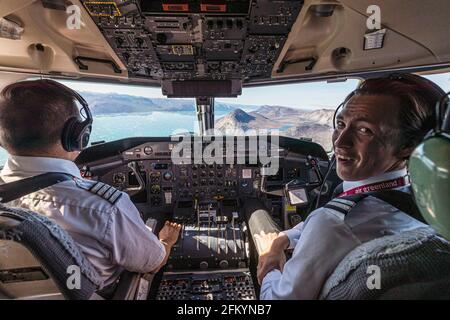 Flight-seeing from the cockpit over Nuuk, or Godthåb, the Capital and the largest city in Greenland. Stock Photo