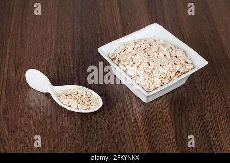 Flaked oatmeal a very healthy cereal. Stock Photo