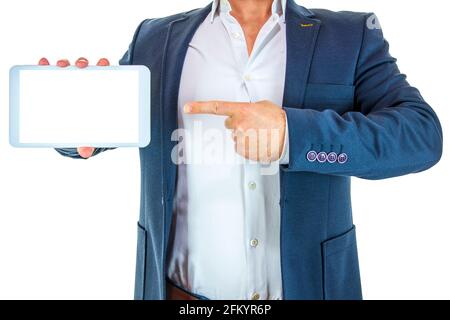 Man in suit pointing the tablet with the index finger while holding the tablet with one hand Stock Photo