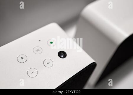 Hi-tech buttons on modern white stereo sound speaker, digital loudspeaker Stock Photo