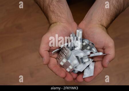 pill packets in hands Stock Photo