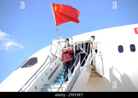 Vientiane. 4th May, 2021. A team of Chinese medical experts, along with medical materials, arrives at the Wattay International Airport in Vientiane, Laos, May 4, 2021, to assist Laos in fighting the COVID-19 pandemic. Credit: Zhang Jianhua/Xinhua/Alamy Live News Stock Photo