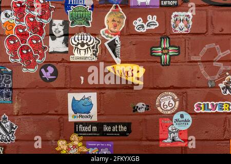 #ABQstickerwall (wall of stickers in downtown Albuquerque, N.M. alleyway) Stock Photo