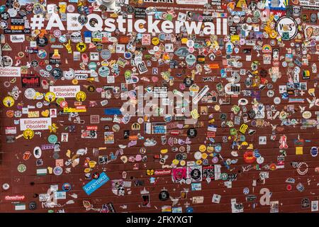 #ABQstickerwall (wall of stickers in downtown Albuquerque, N.M. alleyway) Stock Photo