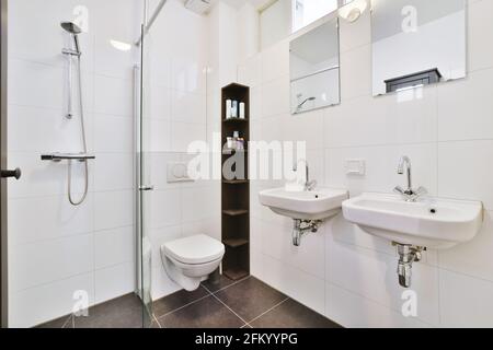 Interior of white modern bathroom in apartment Stock Photo