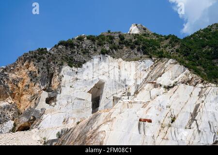 Terraced rock face in open pit Carrara marble mines or quarries, Carrara, Tuscany, Italy Stock Photo