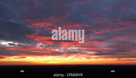 Only sky at sunset, abstract view with red and orange clouds Stock Photo