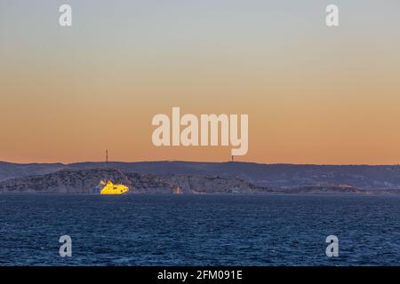 Ferry approaching Marseille ferry terminal at dawn. Marseille, France Stock Photo