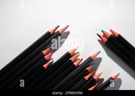 Lyon (France), May 02, 2021. Coloured pencils lined up on a white sheet. Stock Photo