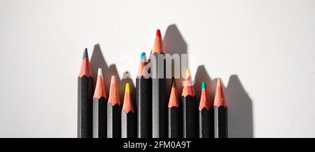 Lyon (France), May 02, 2021. Coloured pencils lined up on a white sheet. Stock Photo
