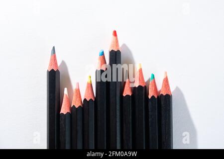 Lyon (France), May 02, 2021. Coloured pencils lined up on a white sheet. Stock Photo