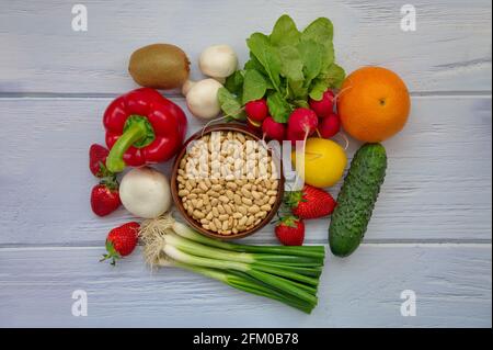 Top view of healthy fruits and vegetables on wooden background Stock Photo