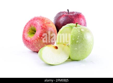 Three very fresh apples with water droplets: stark delicious, granny smith and royal gala. Colorful fruits isolated on white background. Stock Photo