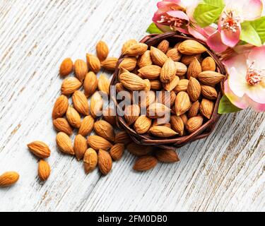 The kernels of apricot pits on a old wooden background Stock Photo