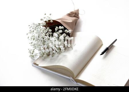 Mockup on a white isolated background with gentle flowers and plants. Cute feminine image. Blank space. Stock Photo