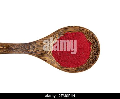 Flat lay view of red color beetroot superfood powder on wood spoon, isolated on white with lot of copy space. Stock Photo