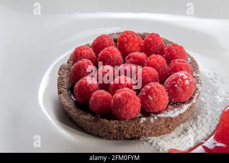 Small chocolate tart with raspberries Stock Photo