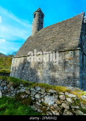 Round Tower and Graveyard in Glendalough Early Monastic Site, County Wicklow, Ireland, Europe Stock Photo