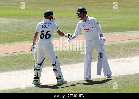 Jake Libby (R) of Notts is congratulated on reaching his fifty by Billy Root during Essex CCC vs Nottinghamshire CCC, Specsavers County Championship D Stock Photo