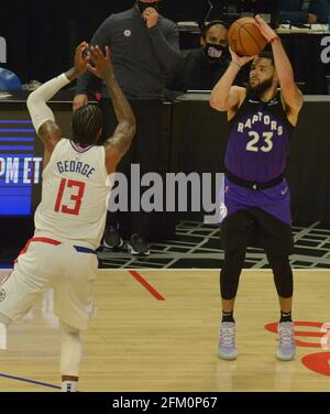 Los Angeles, USA. 05th May, 2021. Toronto Raptors' guard Fred VanVleet (23) scores a three-point basket over Los Angeles Clippers' guard Paul George (13) during the second half at Staples Center in Los Angeles on Tuesday, May 4, 2021. The Clippers defeated the Raptors 105-100 to end a three-game losing streak. Photo by Jim Ruymen/UPI Credit: UPI/Alamy Live News Stock Photo