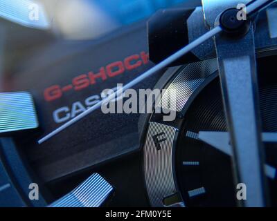 Macro closeup of a Casio GST-B200 analog digital chronograph Bluetooth carbon core wrist watch on a black silicone carbon fibre strap Stock Photo