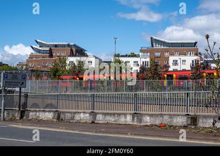 Kingston Upon Thames London UK, May 04 2021, Development Of Luxury Town Centre Apartments Or Flats With A Railway Train In The Foreground Stock Photo
