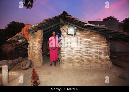 Tribal woman standing in front of her house at Boriborivalsa Village in Araku, Andhra Pradesh, India. PARANGIPERJA TRIBE Stock Photo