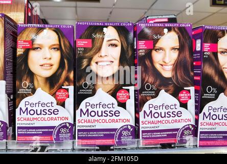 Berlin, Germany - April 22, 2021: View to a shelf with packs of hair dye in a supermarket. Stock Photo