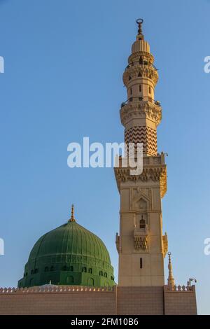 The famous Green Dome and beautiful minaret of Prophet Mosque - Masjid Nabawi in Medina. Islamic buildings Stock Photo