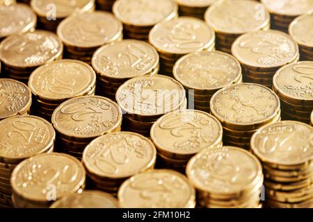 Closeup stacks of 20 cent euro coins placed in rows in bank storage Stock Photo