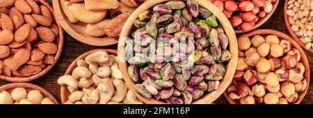 Nuts panorama. Healthy vegan snacks, overhead flat lay Stock Photo