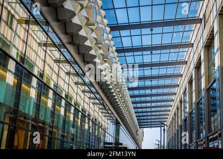 Glass roof with geometric metal partitions. Rows under the roof. Stock Photo