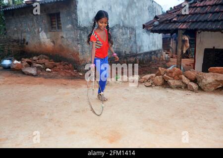 Girl child playing at Gadhyaguda Village, Araku, Andhra Pradesh, India. PARANGIPERJA TRIBE Stock Photo