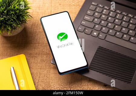 Assam, india - May 04, 2021 : Wechat Pay logo on phone screen stock image. Stock Photo