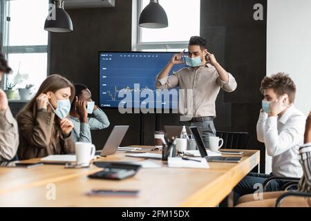 International people wearing medical masks at work Stock Photo - Alamy