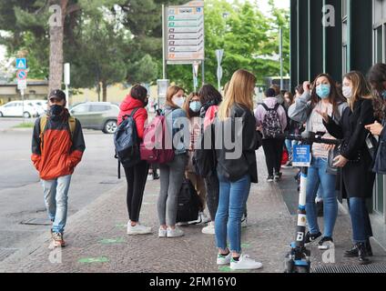 Students traveling on local public transport in Bergamo, Lombardy, Italy. Stock Photo