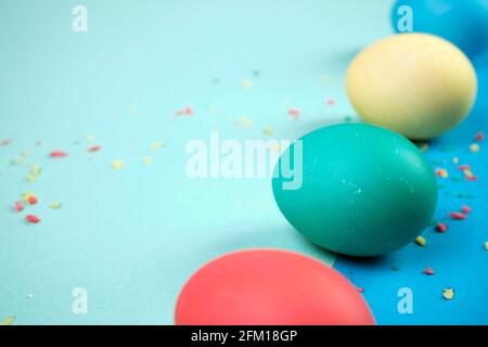 Colored chicken eggs. Easter holiday. Abstraction. Place for text. Stock Photo