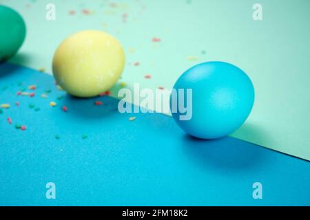 Colored chicken eggs. Easter holiday. Abstraction. Place for text. Stock Photo