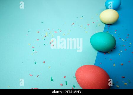 Colored chicken eggs. Easter holiday. Abstraction. Place for text. Stock Photo
