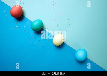 Colored chicken eggs. Easter holiday. Abstraction. Place for text. Stock Photo