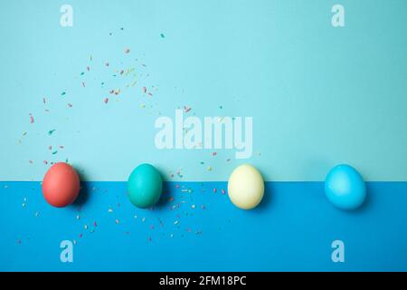 Colored chicken eggs. Easter holiday. Abstraction. Place for text. Stock Photo